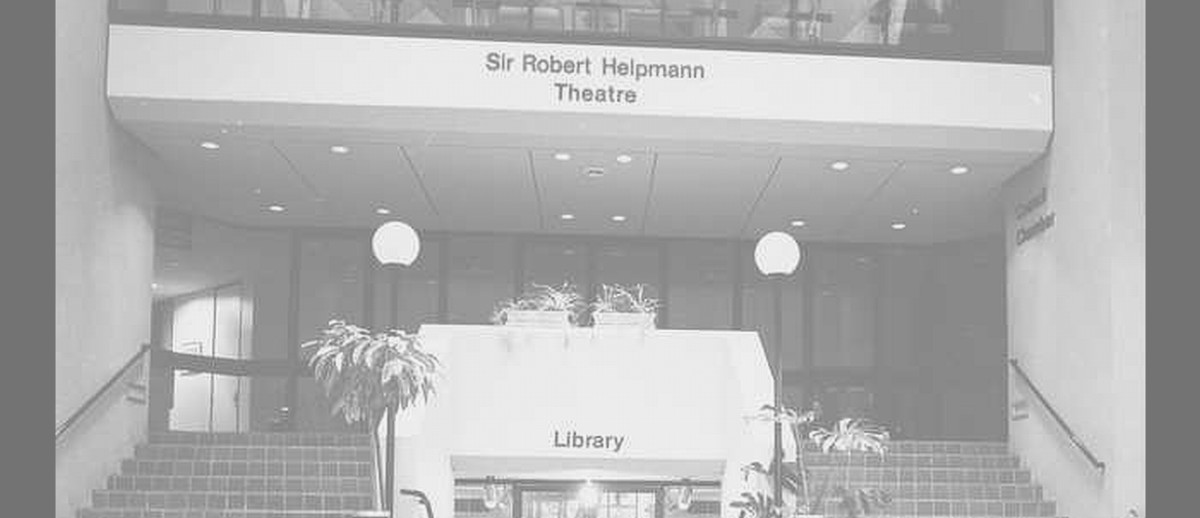 Image: The entrance to a large, modern three-storey building. A sign on the front of the building reads ‘Sir Robert Helpmann Theatre’ 