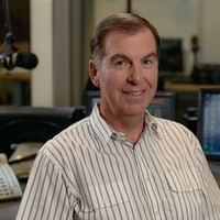 Image: head and shoulder shot of man in radio studio