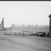 Image: Large white screen with benches in front of it